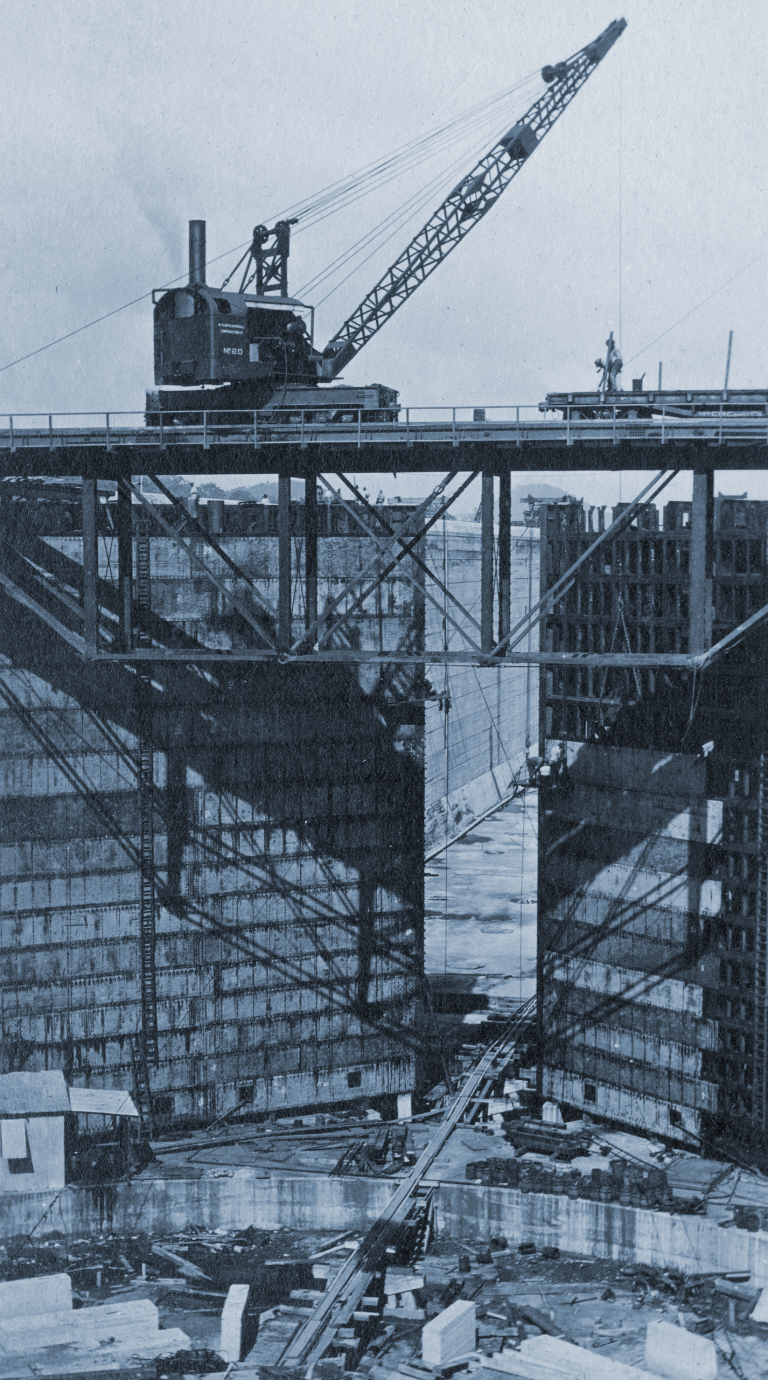A crane above a set of Panama Canal lock gates