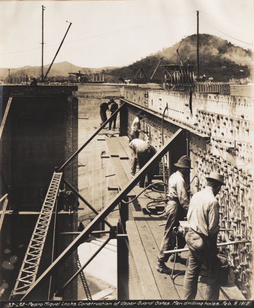 Workers drilling holes on the Panama Canal Pedro Miguel locks