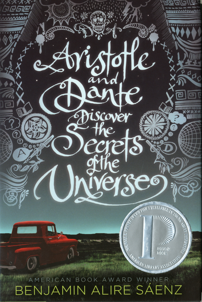 The book cover of Benjamin Alire Sáenz's Aristotle and Dante Discover the Secrets of the Universe displaying an illustration of a red pickup truck on grass overlooking a landscape view.
